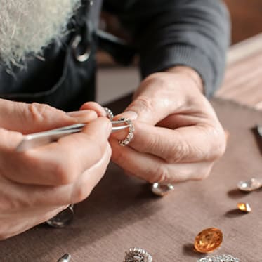 Repairing jewelry by an expert.