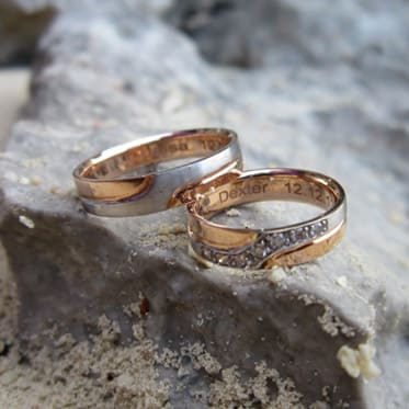 Couple wedding rings with engrave characters.